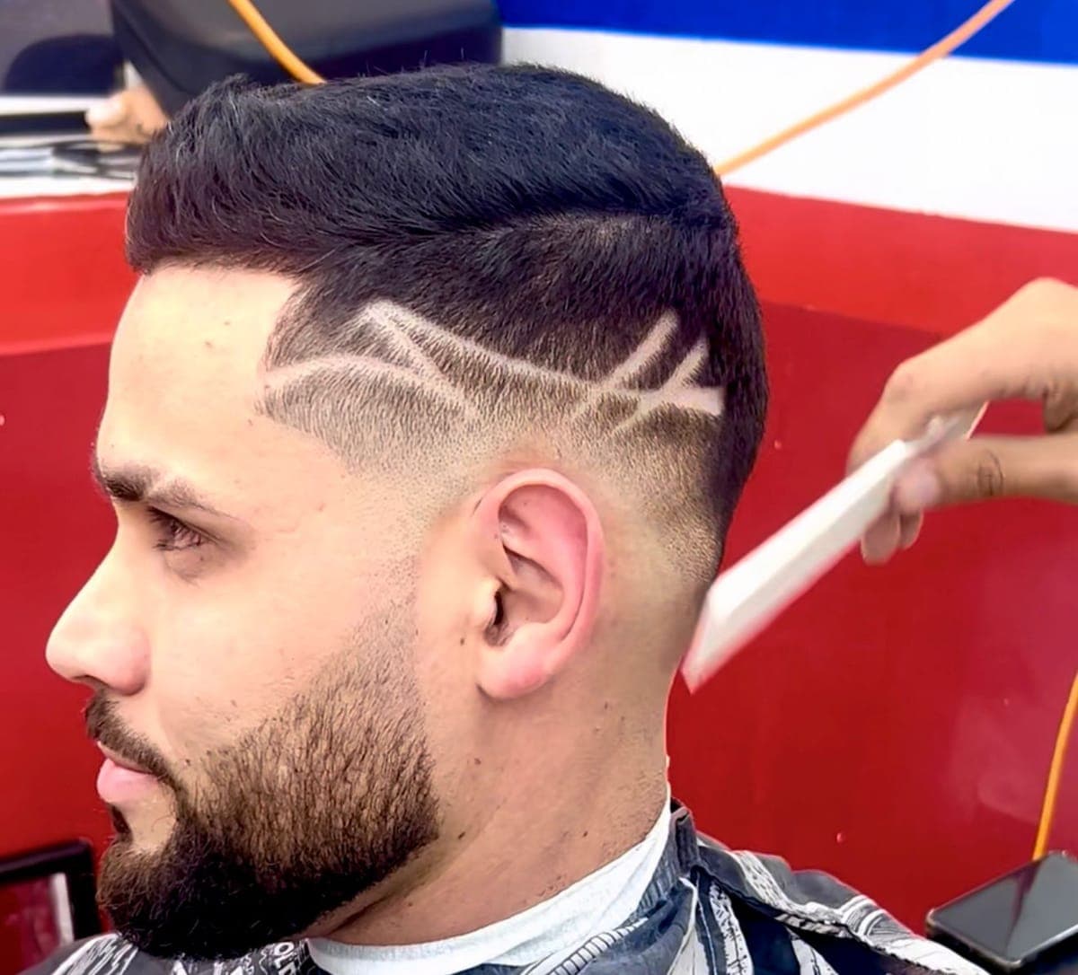 Double slash design over a drop fade