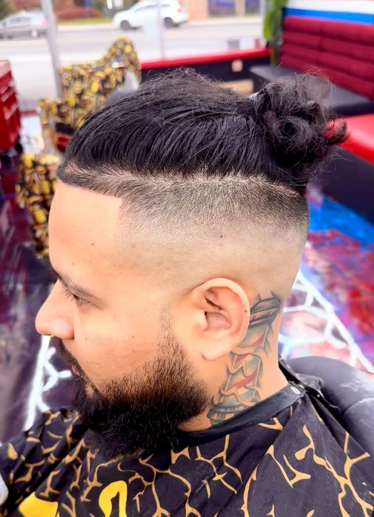 Low fade with a razor design behind the ear