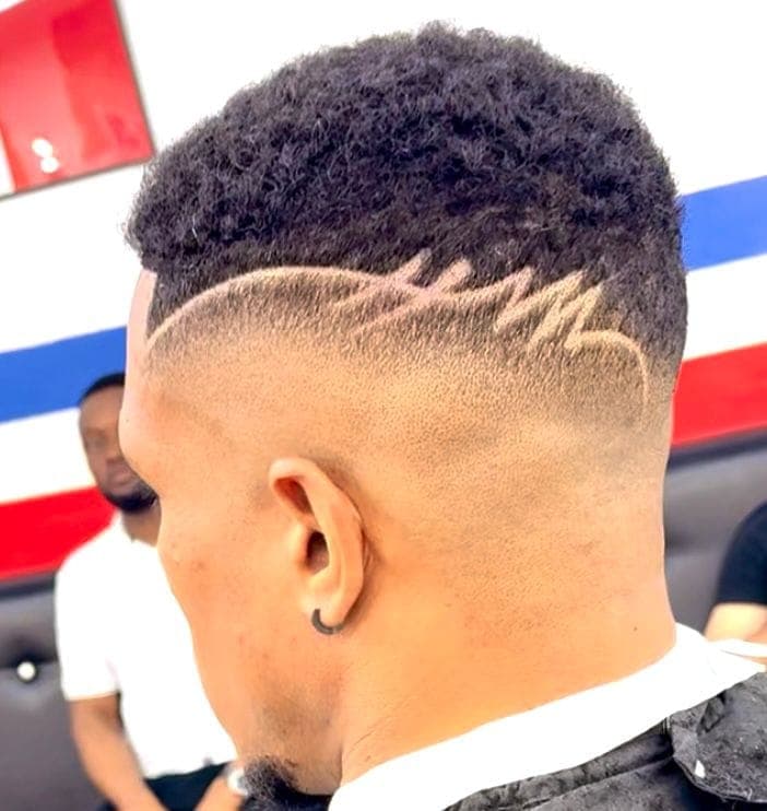 Lightning bolt design cut into the back of a fade